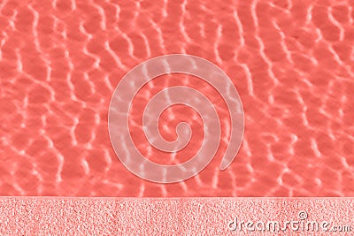 Ripple Water in swimming pool with sun reflection. Living Coral Color of the year 2019 Stock Photo