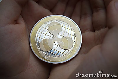 Ripple XRP Coin in a Hands Editorial Stock Photo