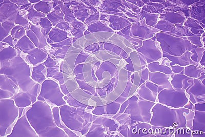 Rippled pattern of clean water in a purple swimming pool for background Stock Photo