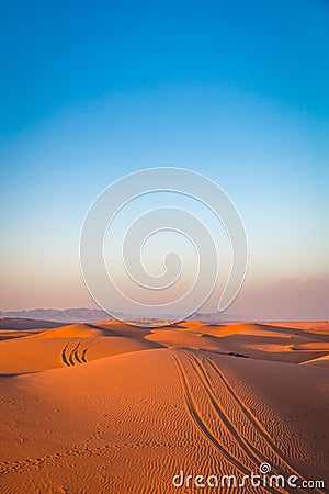 Sand dunes in the golden desert of Al Wasil, central Oman. Stock Photo