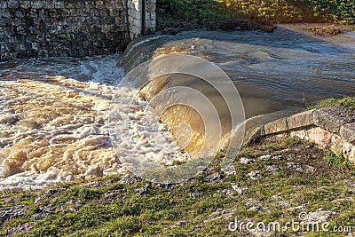 Rised water level in the creek after snow melted. Flood risk. Global warming concept Stock Photo