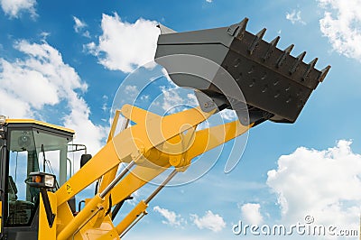 Risen loader shovel Stock Photo