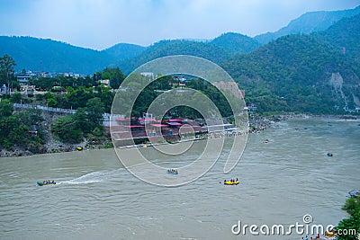 Rishikesh in India very beautiful scenery with boat in the river ganges in Rishikesh lake in the mountains of Himalayas exotic tou Stock Photo