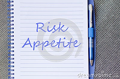 Risk appetite write on notebook Stock Photo