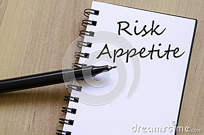 Risk appetite write on notebook Stock Photo