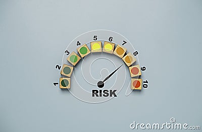Risk level indicator rating print screen wooden cube block since low to high on blue background for Risk management and assessment Stock Photo