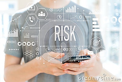 Risk with man using a smartphone Stock Photo