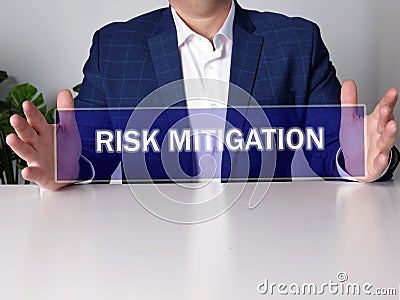 RISK MITIGATION text in futuristic screen Stock Photo