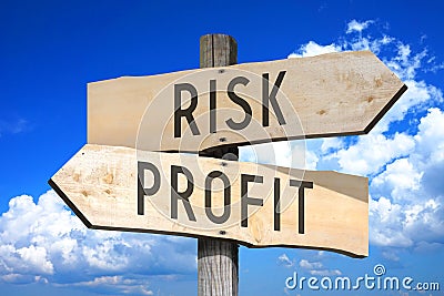 Risk, profit - wooden signpost Stock Photo