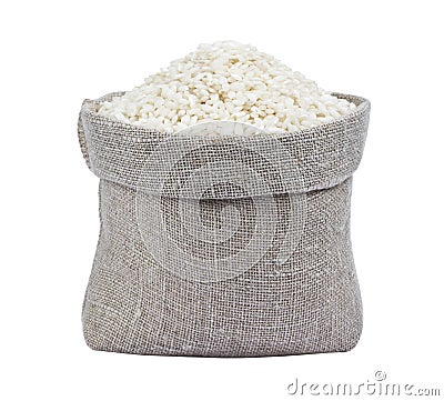 Risotto rice in burlap bag isolated on white Stock Photo
