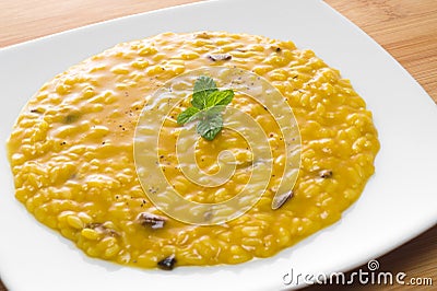 Risotto with saffron and mushrooms Stock Photo