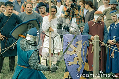 RITTER WEG, MOROZOVO, APRIL 2017: Festival of the European Middle Ages. Medieval joust knights in helmets and chain mail battle on Editorial Stock Photo