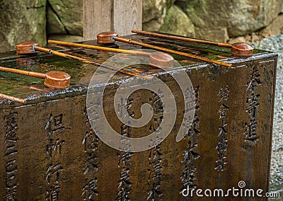Ritual purification fountain at an Japanese Temple Editorial Stock Photo