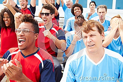 Rival Spectators Watching Sports Event Stock Photo