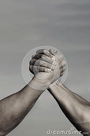 Rivalry, vs, challenge, strength comparison. Two men arm wrestling. Arms wrestling, competition. Rivalry concept - close Stock Photo