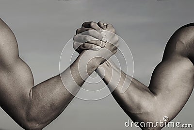 Rivalry, vs, challenge, strength comparison. Two men arm wrestling. Arms wrestling, competition. Rivalry concept - close Stock Photo