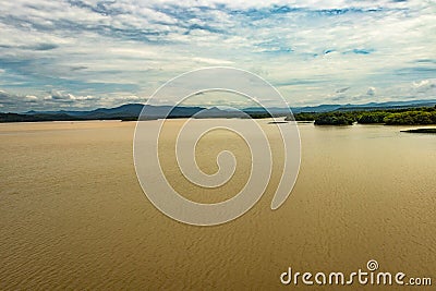 River backwater with mangrove forest and bright sky Stock Photo