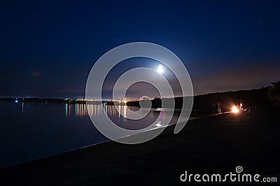 River Bank at night, fishermen on the Bank by the fire Stock Photo