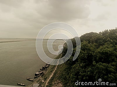 This river bank with tree and boat very attractive artistic beautiful and natural Stock Photo