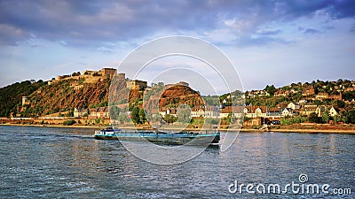 River Barge on the Rhine River with Ehrenbreitstein Fortress in the background. Editorial Stock Photo