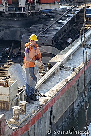 River barge with worker posing Editorial Stock Photo