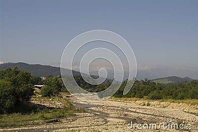 The river bed of the mountain river and foothills. Stock Photo