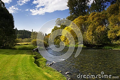 River with Blue Sky and Trees Stock Photo