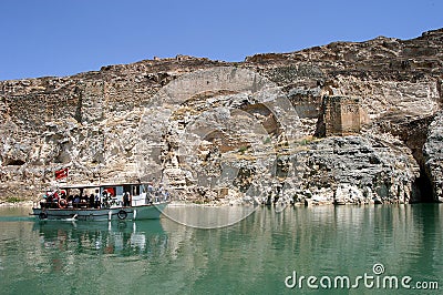 River boat in front of abandoned castle Rum Kale in Firat River Editorial Stock Photo
