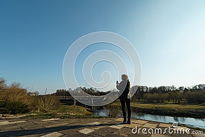 River with a bridge in the backround in Sabile, Latvia Stock Photo