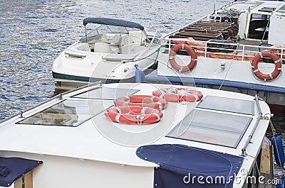 River buses with lifebuoys Stock Photo