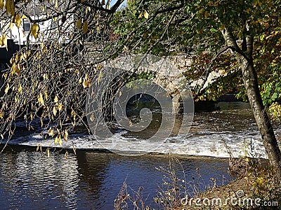 The River Calder with the bridge across it in Padiham Town Centre. Stock Photo