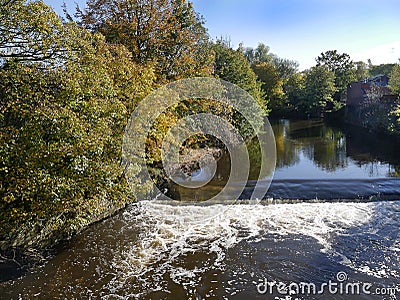 The River Calder from the bridge across it in Padiham Town Centre. Stock Photo