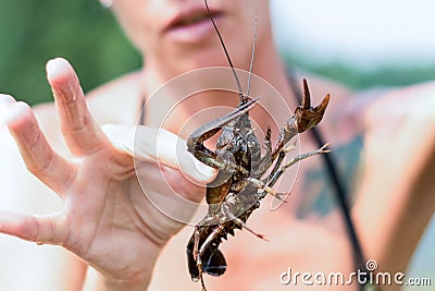 River cancer in a woman in her hands Stock Photo