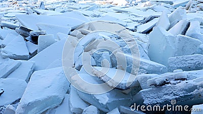 River covered with piles of ice smithereens Stock Photo