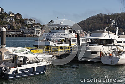 River Dart, Dartmouth, Devon a tourist excursion boat arriving on a jetty. Editorial Stock Photo