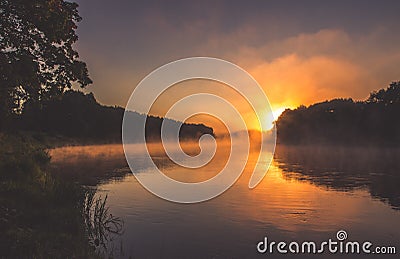 River at dawn with mist Stock Photo