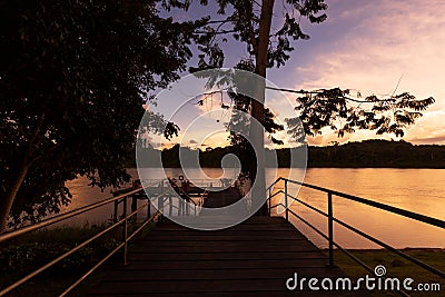 Shimmering Sunset And River Deck View In The Amazon Stock Photo