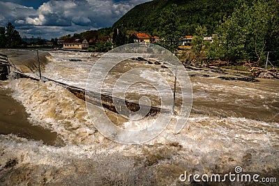 River floods in fall season after heavy rain. High rise river water in Tacen Whitewater Course, Slovenia Stock Photo