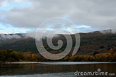 River flow and colourful autumn forest Stock Photo