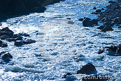 River flowing over rocks Stock Photo