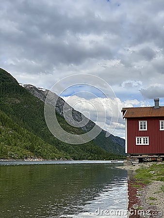 River house in Norway. By the mountain. Nostalgic. Stock Photo