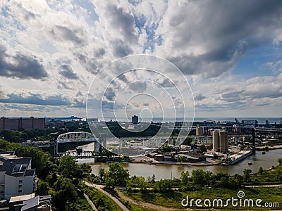 River and industrial area, with raised bridge and sunny skies Stock Photo