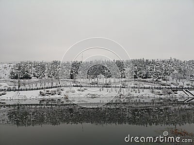 River and invert shadow after snowing in winter Stock Photo