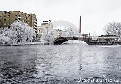 River in the middle of the city on a cold and cloudy winter day