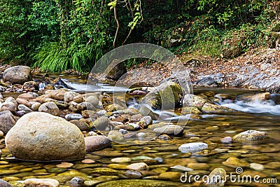 River Miera, wet stones at it. Liérganes, Cantabria, Spain Stock Photo