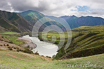 River, mountains and clouds. Stock Photo