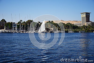 River Nile/ beautiful view for Aswan Egypt and Nubian Egyptian culture. sailing boat sailing in the River Nile and harbor with bir Editorial Stock Photo