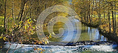 River with rapids, golden autumnal landscape Stock Photo