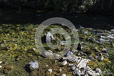 River with rocks as background of Lleida, Catalonia, Spain Stock Photo
