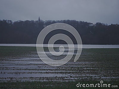 River Ruhr between, citys Hattingen and Bochum during the Christmas flood of 2023, it is raining heavily, the air shimmers with Stock Photo